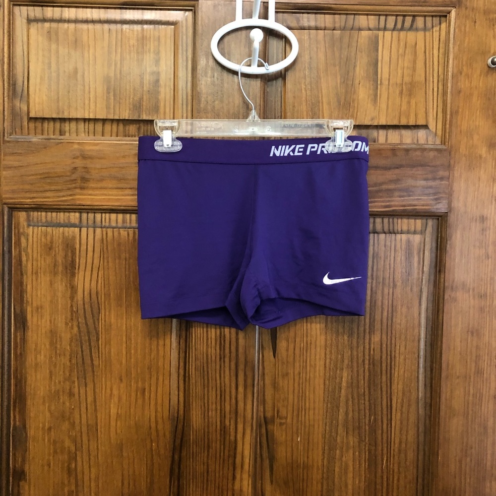 Purple Nike spandex compression shorts
